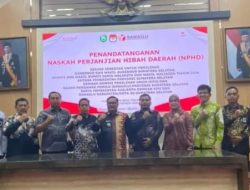 Pj Wako Hadiri Acara Penandatanganan NPHD Untuk Pilkada Serentak 2024